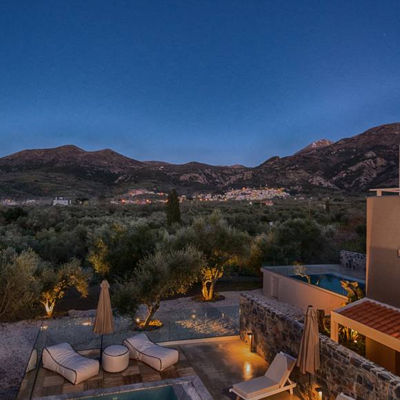 Junior villa pool with night lights, sun loungers and mountain view at Avdou Collection Crete